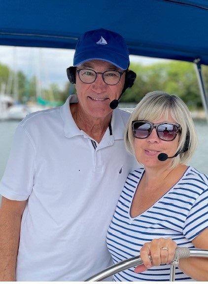 Image of the 2Talks bluetooth Sena headsets worn by boaters. Headsets known as the marriage savers as they help with communication.